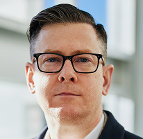 Alexander Hughes, CEO e executivo de uma empresa de trading de criptomoedas, em retrato